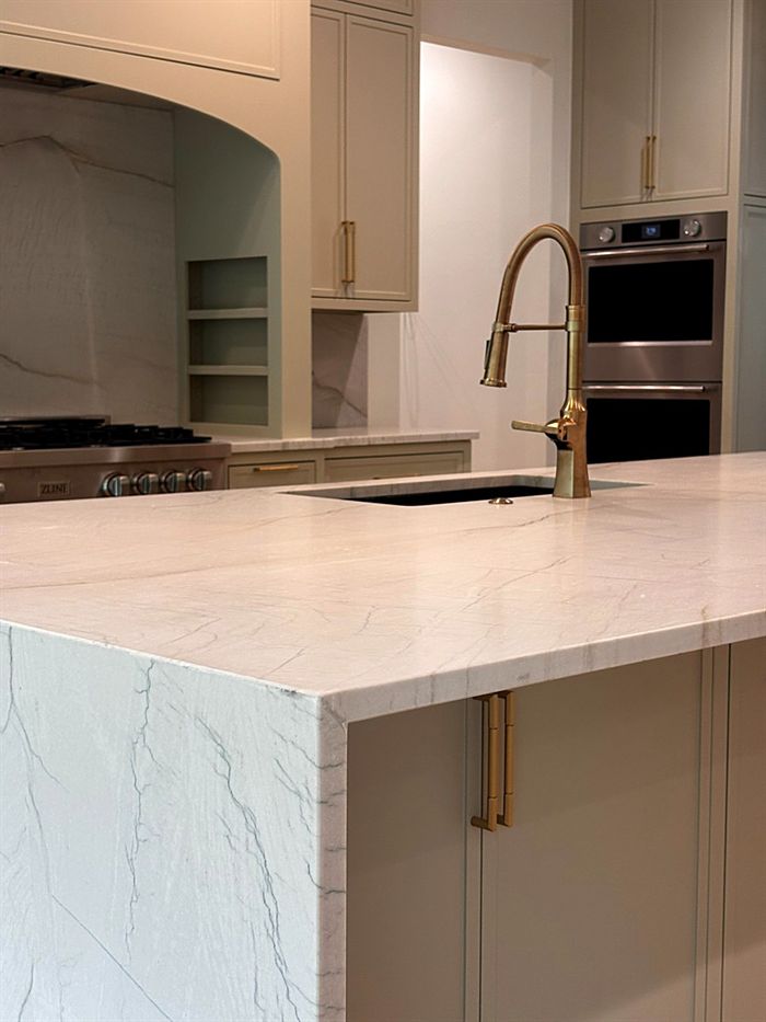111 Bear Den Court &mdash; Marble waterfall island with brass faucet and wall ovens