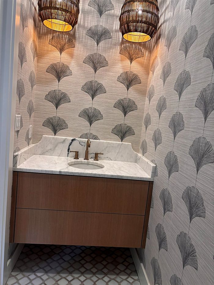 111 Bear Den Court &mdash; Powder room with ginkgo wallpaper and woven pendants
