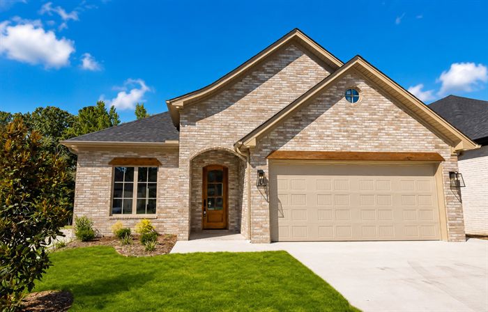 114 Kinley Loop — Front elevation with brick facade and two-car garage