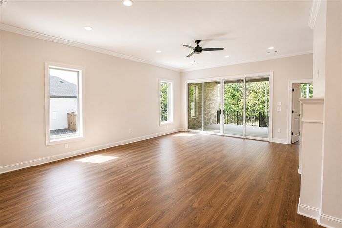 114 Kinley Loop — Open living and dining area with sliding doors to the patio