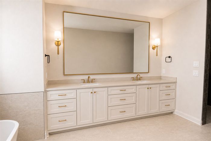 114 Kinley Loop — Primary bath double vanity with framed mirror and sconces