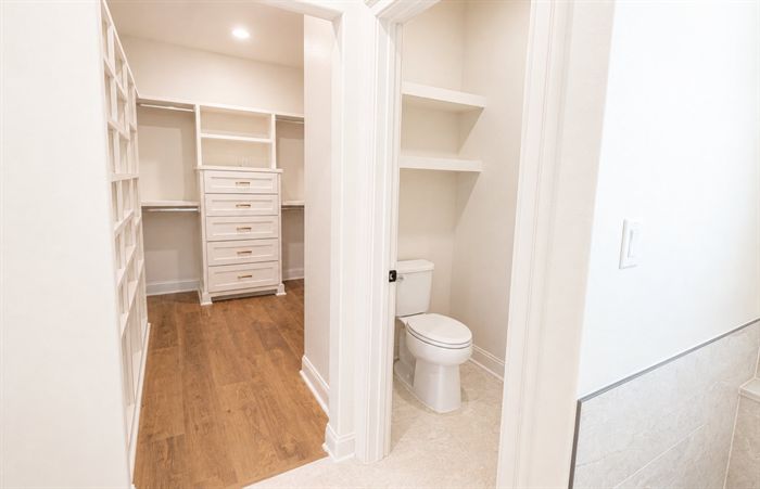 114 Kinley Loop — Built-in linen shelving beside the water closet