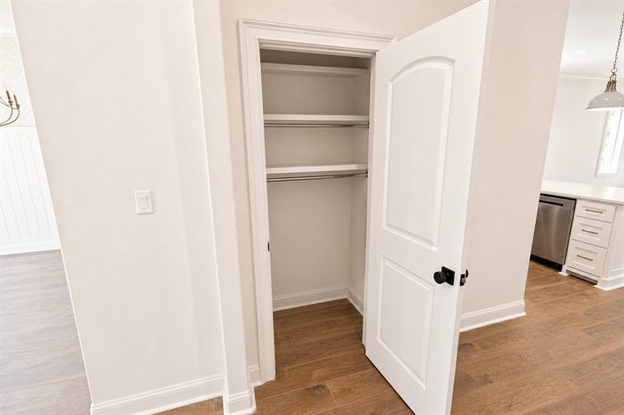 114 Kinley Loop — Closet with wood shelving off the kitchen hall