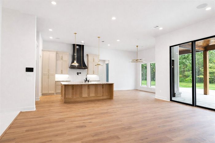 115 Bear Den Court &mdash; Kitchen open to the living room and rear glass wall