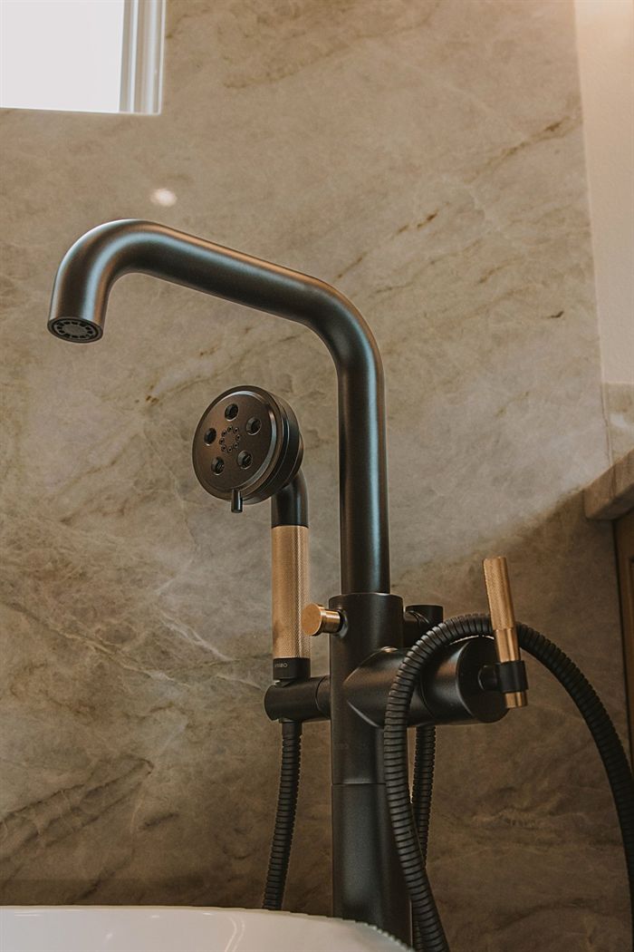 115 Bear Den Court &mdash; Tub filler and handshower against stone