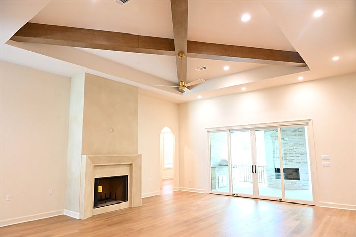 217 Abington Circle &mdash; Great room with beamed ceiling and cast stone fireplace