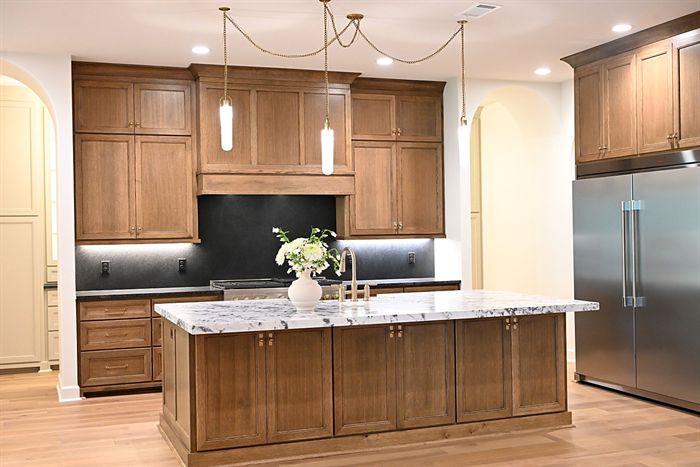 217 Abington Circle &mdash; Stained cabinetry and marble island with waterfall edge