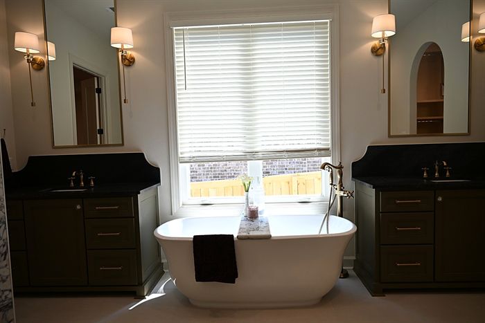 217 Abington Circle &mdash; Primary bath with freestanding tub between vanities