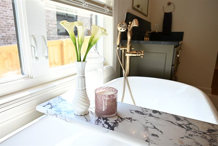 217 Abington Circle &mdash; Soaking tub with marble deck and brass floor filler