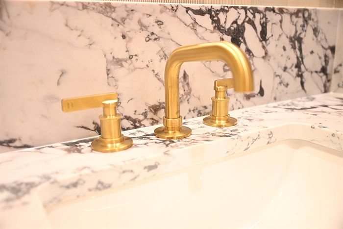217 Abington Circle &mdash; Marble vanity top with brass widespread faucet