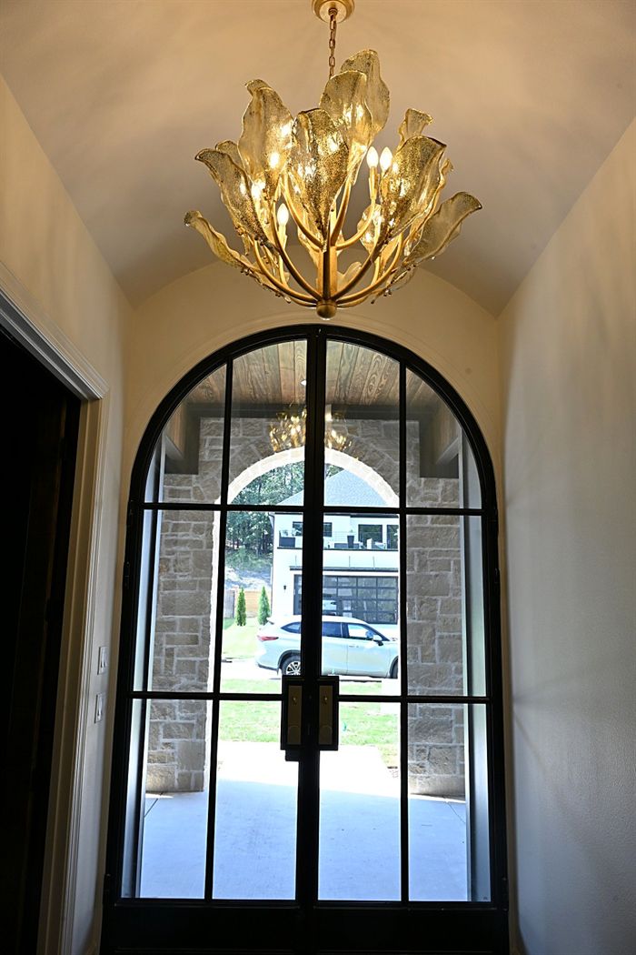 217 Abington Circle &mdash; Arched iron entry door seen from the foyer