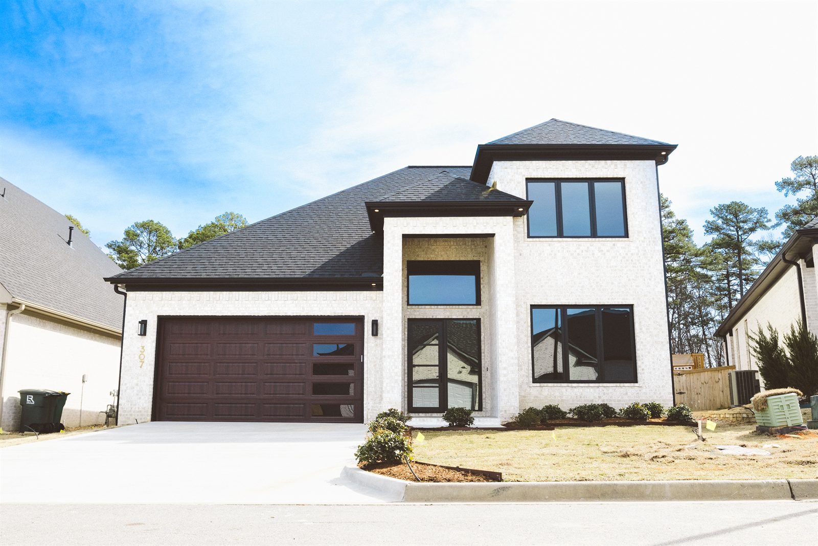 307 Fletcher Loop &mdash; Front elevation in white brick with dark trim