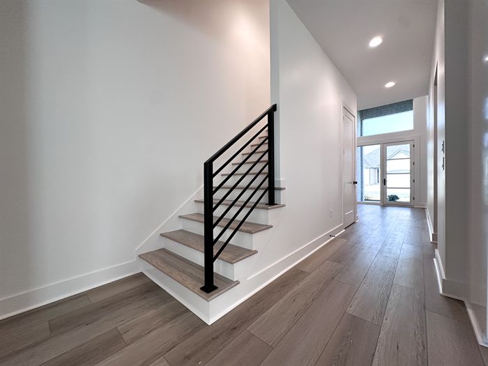 307 Fletcher Loop &mdash; Entry with open staircase and black metal railing