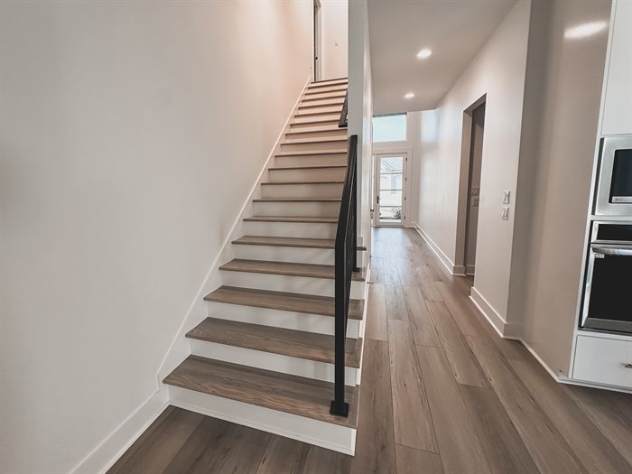 307 Fletcher Loop &mdash; Stair hall with built-in wall ovens