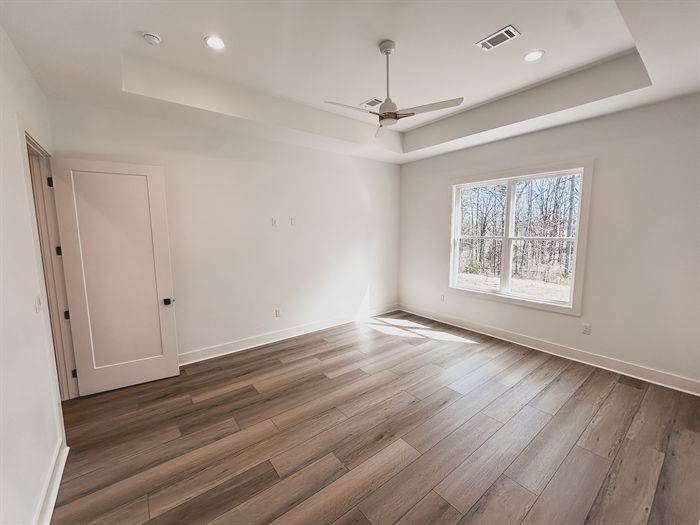 307 Fletcher Loop &mdash; Bedroom with tray ceiling and ceiling fan